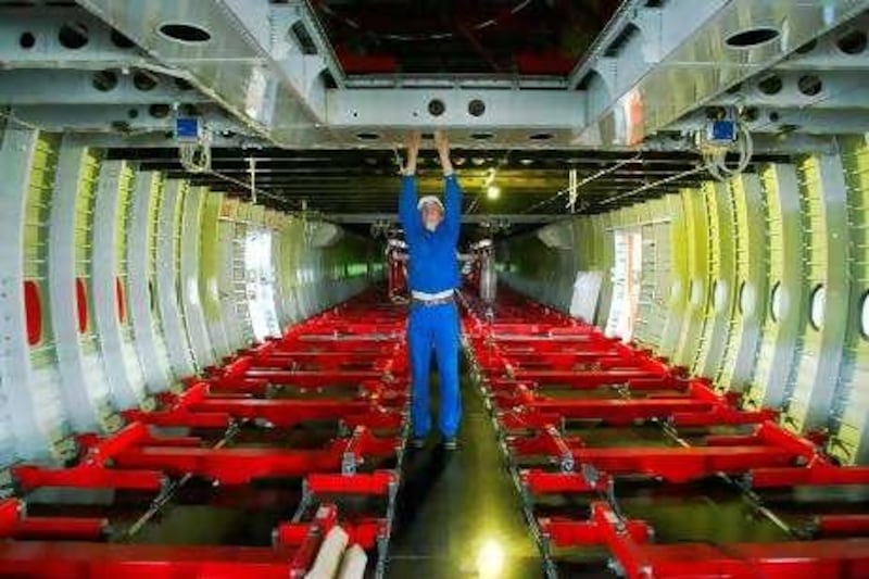 An aircraft mechanic checks the interior of an Airbus A380 at a new test site of the IABG company for the Airbus A380 in Dresden, 05 April 2005. During the following three years, around 47 500 flights of the super-size airliner will be simulated at the new hall to check the world's biggest ever passenger plane's structure and capacity.    AFP PHOTO    DDP/NORBERT MILLAUER    GERMANY OUT