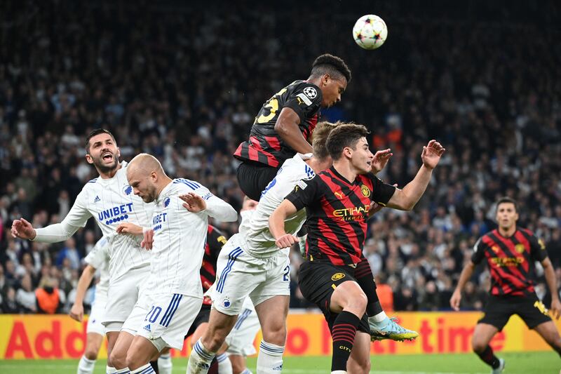 Manchester City's Manuel Akanji rises to make a headed clearance. AFP