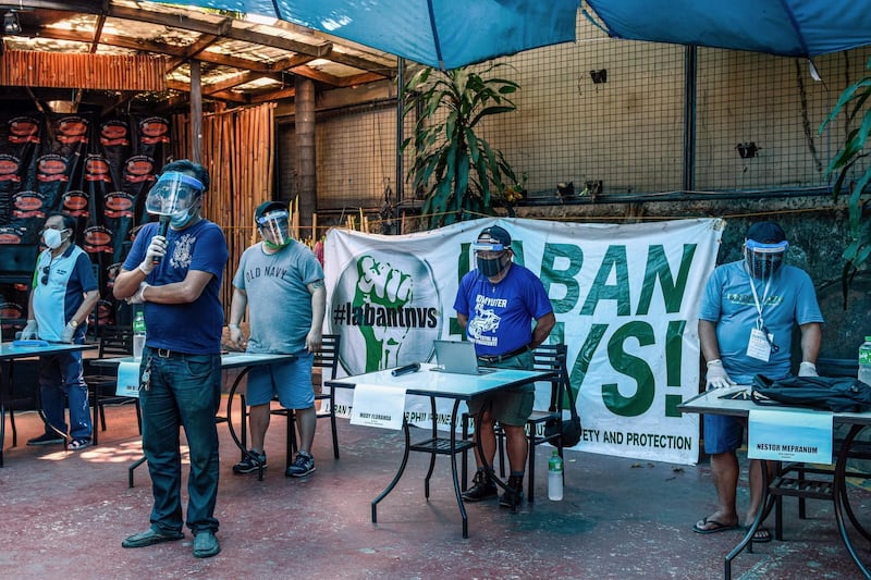 Members of a transport organisation hold a press conference to coincide with May Day, or International Workers' Day, in suburban Manila on May 1, 2020,.  AFP