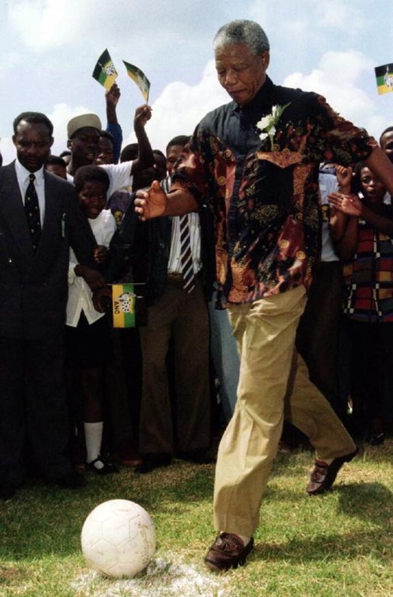 Mandela demonstrates his football skills at an ANC rally in the western Transvaal province in January 1994. Patrick de Noirmont / Reuters