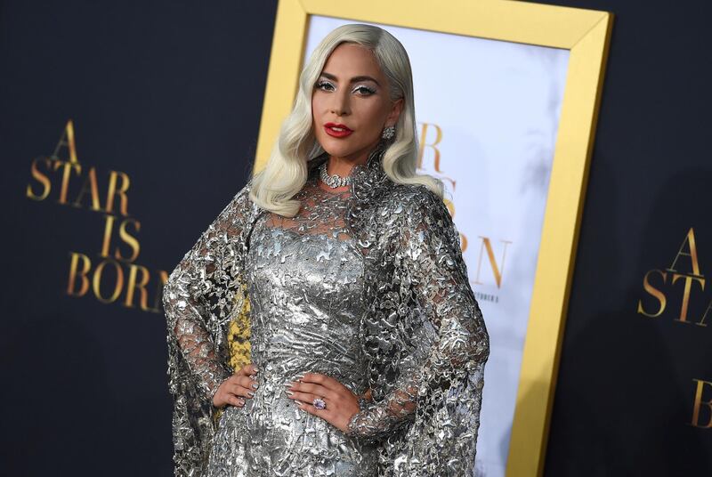 FILE - In this Sept. 24, 2018 file photo, Lady Gaga arrives at the Los Angeles premiere of "A Star Is Born," at the Shrine Auditorium. Lady Gaga is nominated for several Grammy Awards including one for record of the year and song of the year. The Grammy Awards will be held on Sunday. (Photo by Jordan Strauss/Invision/AP, File)
