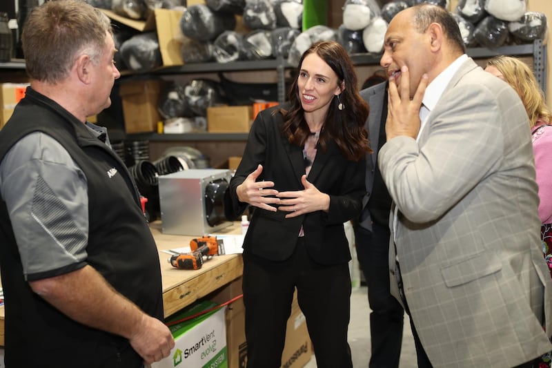 Prime Minister Jacinda Ardern (C), MP Willie Jackson (R) meets with Alister Baird from New Zealand Homes Solutions (L) who employed apprentice Jake Alder under the Mana in Mahi scheme in Tauranga, New Zealand. Getty Images