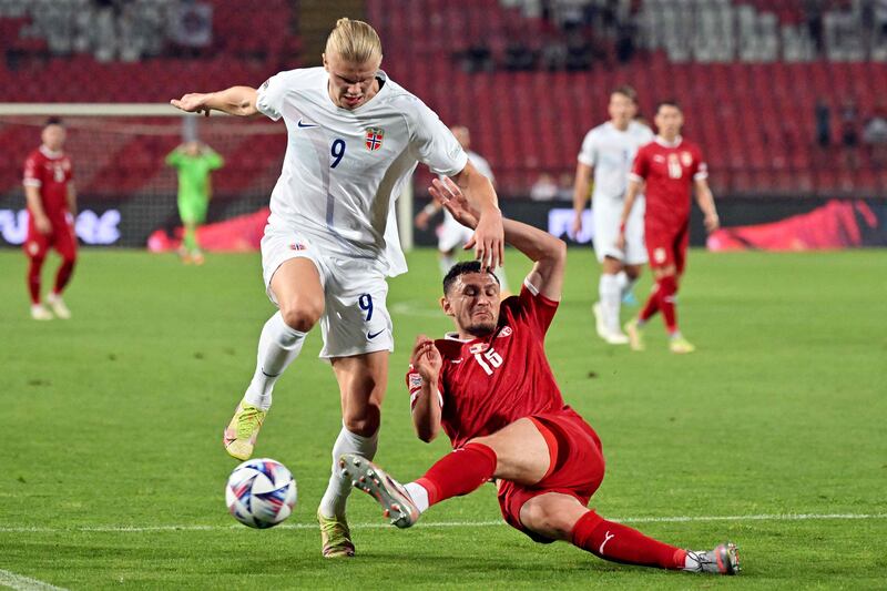 Norway's Erling Haaland fights for the ball with Serbia's Milos Veljkovic. AFP