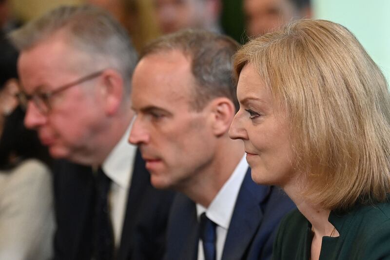 New Foreign Secretary Liz Truss, right, sits next to Deputy Prime Minister Dominic Raab, centre, at the Cabinet meeting. AFP