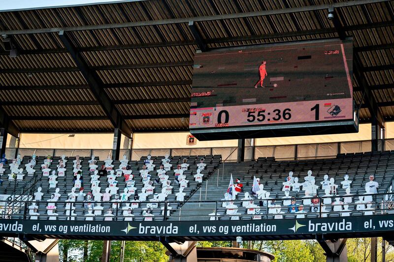 Cardbpard cut-outs of fans are seen in the stands during the 3F Super League football match between AGF and Randers FC. AFP