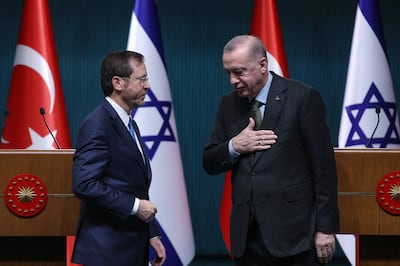 Israeli President Isaac Herzog, left, stands next to his Turkish counterpart Recep Tayyip Erdogan after a press conference in Ankara in March.  AFP