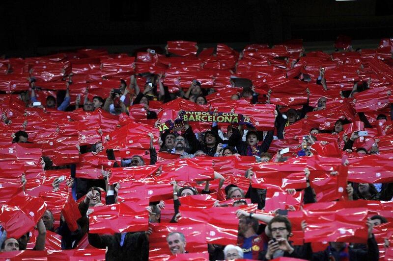Barcelona supporters cheer on their team during the first leg of the Champions League semi-final tie against Bayern Munich on Wednesday. Alberto Estevez / EPA
