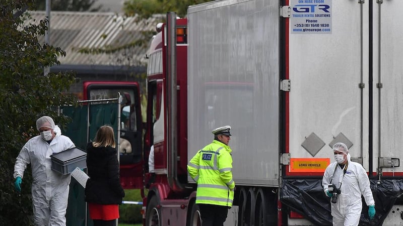 British Police forensics officers work on the lorry found containing 39 dead bodies in October. AFP