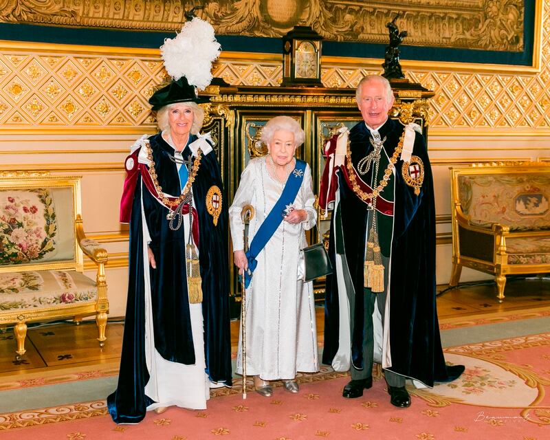 Britain's Queen Elizabeth II, Prince Charles and Camilla, Duchess of Cornwall at Windsor Castle, England, ahead of the Order of the Garter service, on Monday. Buckingham Palace via AP