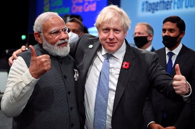 British Prime Minister Boris Johnson and Indian Prime Minister Narendra Modi attend Cop26 in Glasgow last November. Reuters