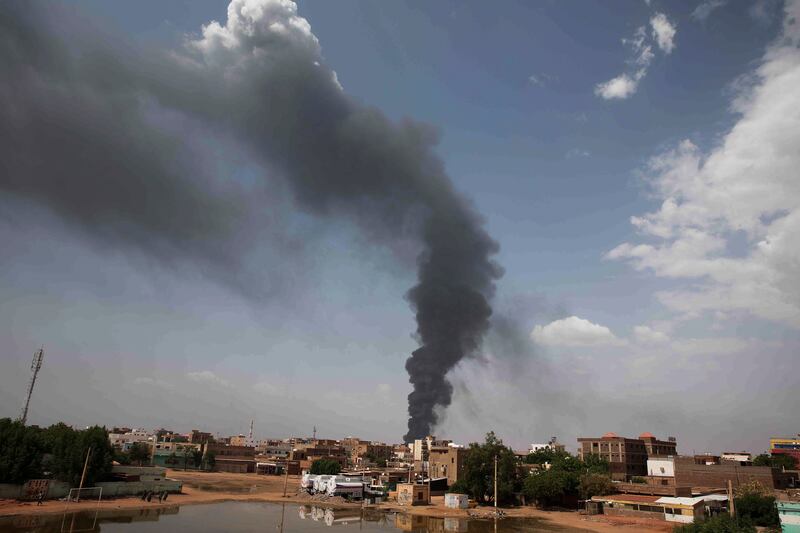 Smoke rises over Khartoum on Thursday as fighting continues. AP