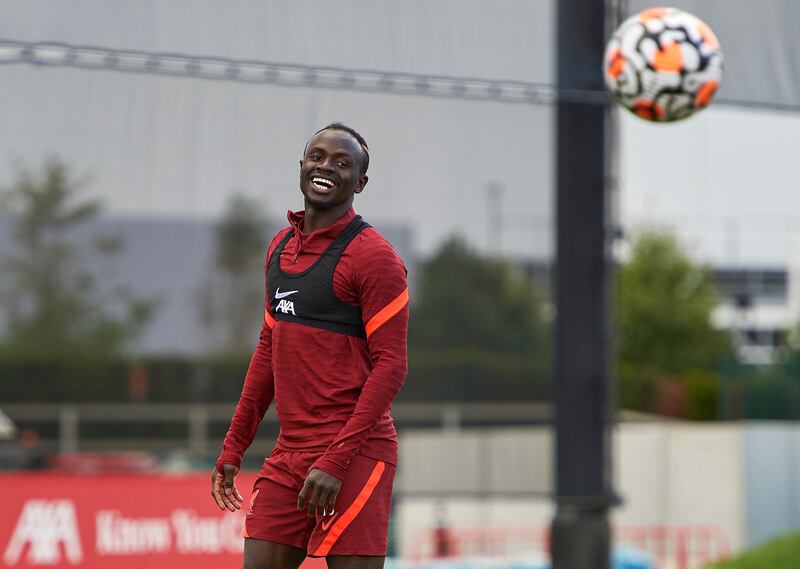 Sadio Mane of Liverpool smiles during a training session at AXA Training Centre in Kirkby, England.