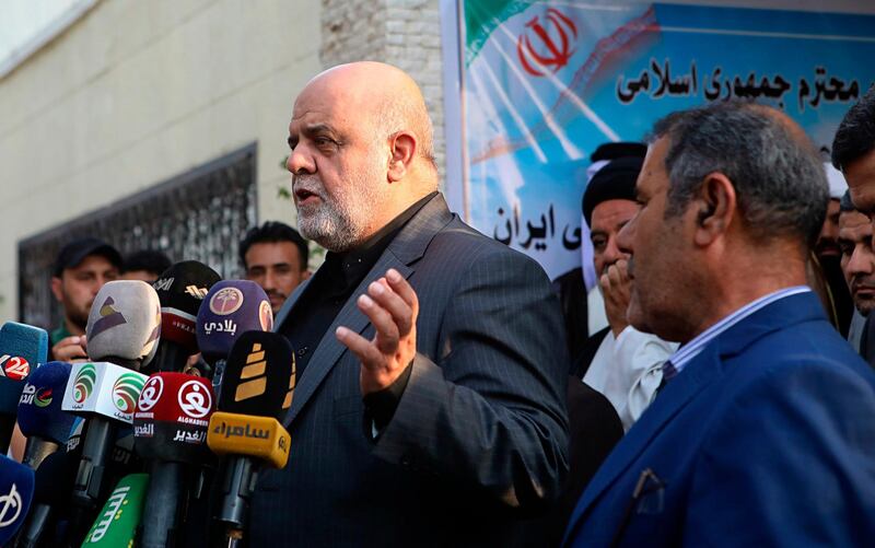 Iraj Masjedi, center, the  Iranian Ambassador to Iraq, speaks to reporters during the reopening of the Iranian consulate in Basra, 340 miles (550 km) southeast of Baghdad, Iraq, Tuesday, Sept. 11, 2018. Demonstrators stormed and burned the Iranian consulate during protests last Friday. (AP Photo/Nabil al-Jurani)
