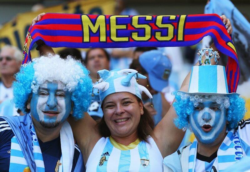 Argentina fans shown with a Messi scarf prior to Argentina's match against Iran on Saturday at the 2014 World Cup in Belo Horizonte, Brazil. Ronald Martinez / Getty Images / June 21, 2014