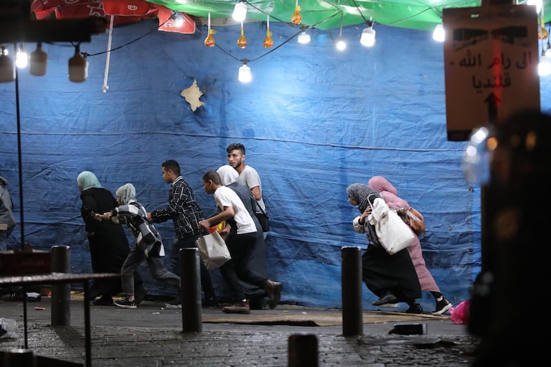 Palestinians run away from Israeli border police during a demonstration in support of Palestinian families that face eviction from their homes at Sheikh Jarrah neighbourhood in the Damascus gate in Jerusalem. EPA