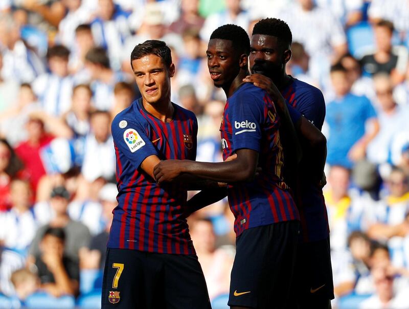 Barcelona's Philippe Coutinho, Ousmane Dembele and Samuel Umtiti celebrate Demebele scoring their side's second goal. Reuters