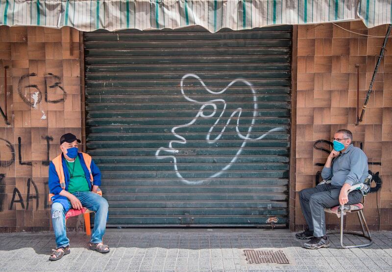 Moroccans wearing protective face masks are pictured in Casablanca. AFP