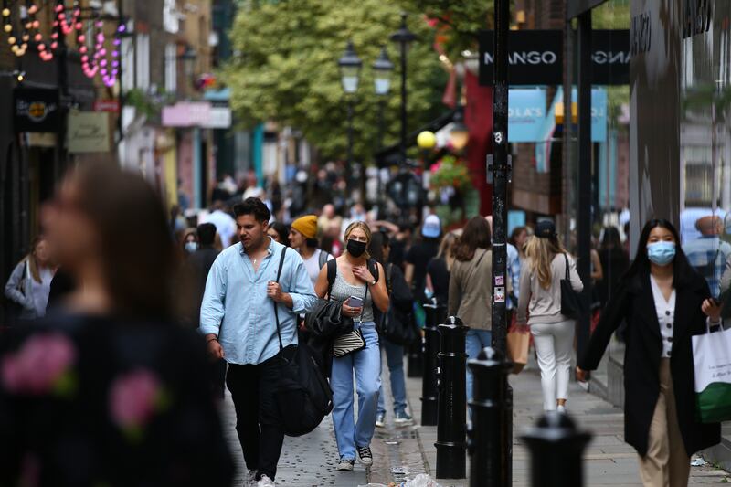 People wear face masks while shopping in Covent Garden, London, on July 4, 2021. Getty