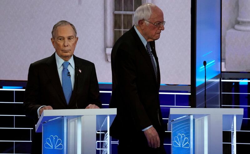 Senator Bernie Sanders walks behind former New York City Mayor Mike Bloomberg during a break at the ninth Democratic 2020 U.S. Presidential candidates debate at the Paris Theater in Las Vegas, Nevada, U.S., February 19, 2020. REUTERS/Mike Blake TPX IMAGES OF THE DAY