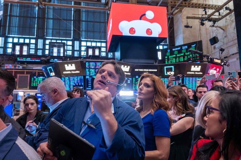 The trading floor of the New York Stock Exchange is busy as Reddit prepares for its IPO and techs perform well. Getty Images