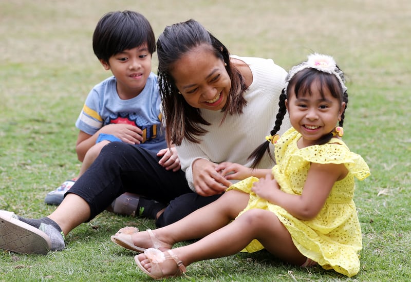 Ms Taboclaon with her son Wayne, six, and Aya, three