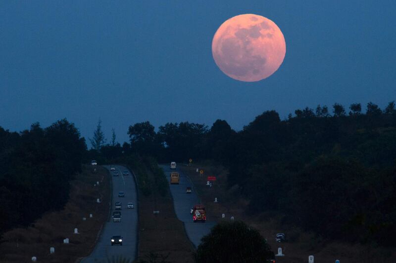 The supermoon rises over a highway near Yangon, Myanmar. Ye Aung Thu / AFP
