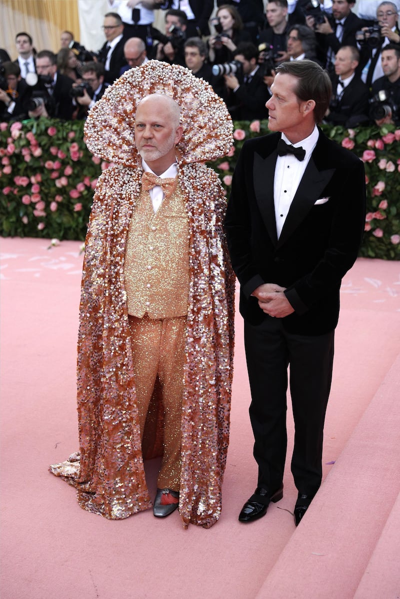 US screenwriter Ryan Murphy (left) arrived in a shimmering high collared cape that was an intriguing blend of Emperor Ming and My Little Mermaid.    EPA