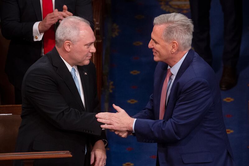 Mr McCarthy and Mr Scalise shake hands after Mr Scalise nominated the California Republican for House speaker. EPA