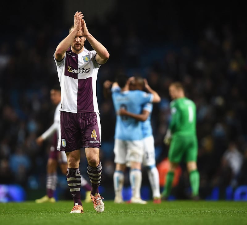 MANCHESTER, ENGLAND - MAY 07:  Ron Vlaar of Aston Villa applauds the fans after the Barclays Premier League match between Manchester City and Aston Villa at Etihad Stadium on May 7, 2014 in Manchester, England.  (Photo by Laurence Griffiths/Getty Images)