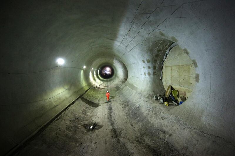 A worker walks through the partially completed Crossrail Bond Street station tunnel. Peter Macdiarmid / Getty Images