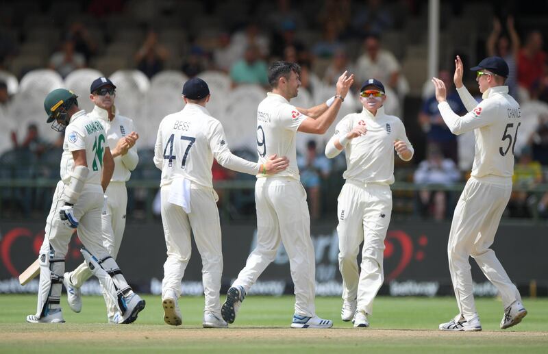 England bowler James Anderson, cente, is congratulated by teammates after taking the wicket of Kashev Maharaj. Getty