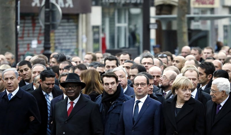 (From L) Israeli Prime Minister Benjamin Netanyahu, Malian President Ibrahim Boubacar Keita, bodyguard, French President Francois Hollande, German Chancellor Angela Merkel and Palestinian president Mahmud Abbas take part in a Unity rally “Marche Republicaine” in Paris on January 11, 2015 in tribute to the 17 victims of a three-day killing spree by homegrown Islamists. The killings began on January 7 with an assault on the Charlie Hebdo satirical magazine in Paris that saw two brothers massacre 12 people including some of the country's best-known cartoonists, the killing of a policewoman and the storming of a Jewish supermarket on the eastern fringes of the capital which killed 4 local residents. AFP PHOTO / PATRICK KOVARIK (Photo by PATRICK KOVARIK / AFP)