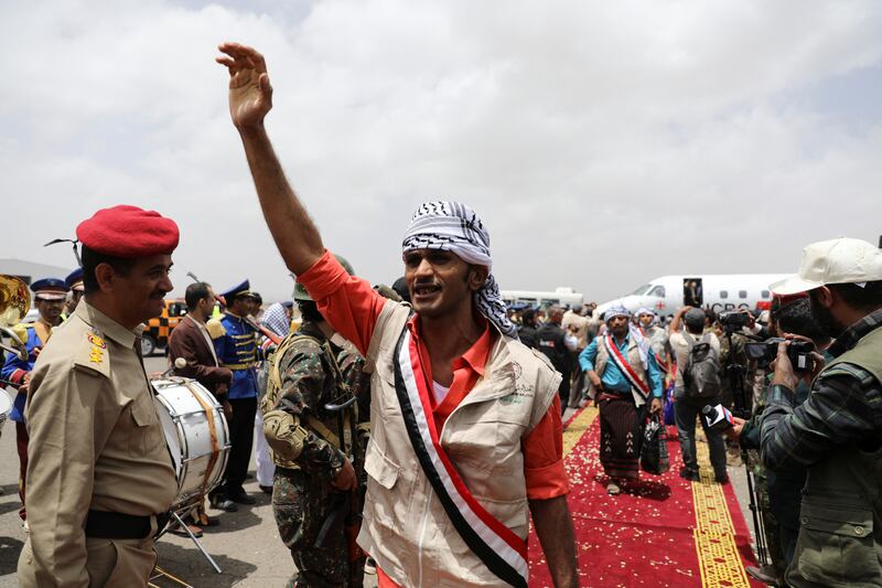 Freed prisoners celebrate after arriving in Sanaa following a swap between warring parties in Yemen. Reuters