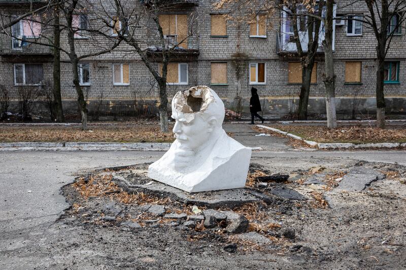 A damaged bust of Vladimir Lenin lies in the street in March 2023 in in the strategic town of Lyman. Getty Images