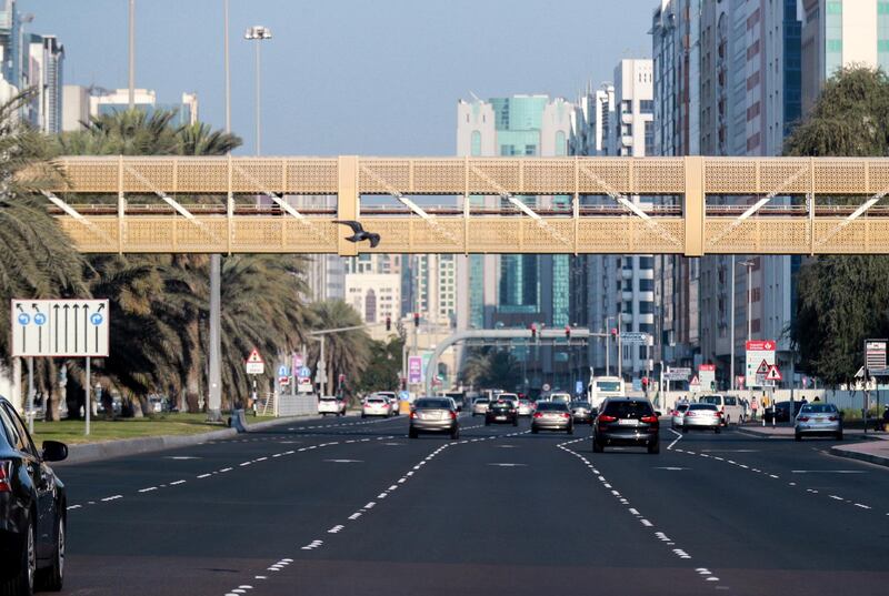 Abu Dhabi, United Arab Emirates, December 15, 2020.  Commuters wait for their bus at central Abu Dhabi on a chilly Tuesday morning.
Victor Besa/The National
Section:  NA
for:  Standalone/Weather