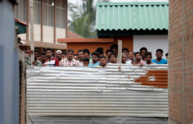 People look at the site of the gunbattle. Reuters