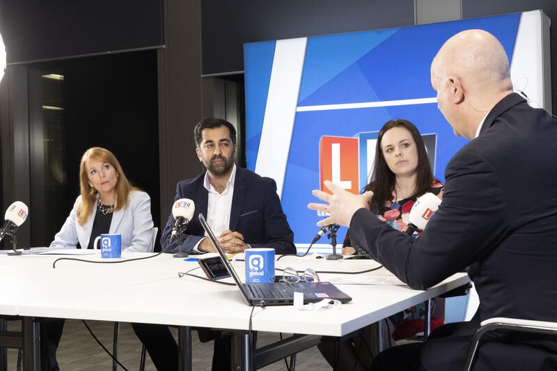 Former minister Ash Regan, left, Scottish Health Secretary Humza Yousaf, centre, and Finance Secretary Kate Forbes, right, take part in a debate on LBC in Glasgow. PA
