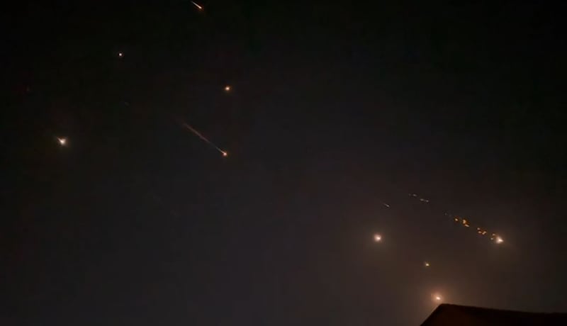 Explosions light up the sky in Hebron in the Palestinian territories during the attack. Screengrab from AFPTV / AFP