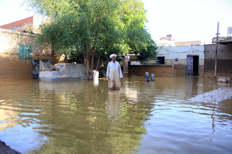 A picture taken October 29, 2016 shows a local man inspecting the damage following heavy floods in Ras Gharib, near the mouth of the Gulf of Suez in the Red Sea governorate, after flooding in parts of Egypt caused by torrential rains. - At least 22 people were killed and 72 injured in flooding in parts of Egypt caused by torrential rains, authorities said, updating an earlier toll of 18 dead. Ras Gharib, was the worst hit area with nine people killed in the flooding. (Photo by Mostafa EL-SHEMY / AFP)
