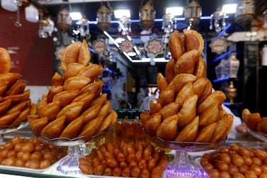 A picture taken on April 27, 2021 shows traditional sweets known as "Qatayef", commonly served during the Muslim holy month of Ramadan, at a shop in Damascus' Midan neighbourhood. / AFP / LOUAI BESHARA