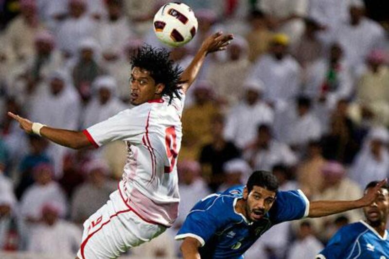 Mohamed Al Shehhi, left, went flying to nudge a header but he and his UAE teammates could not keep the speedy Kuwait side grounded.