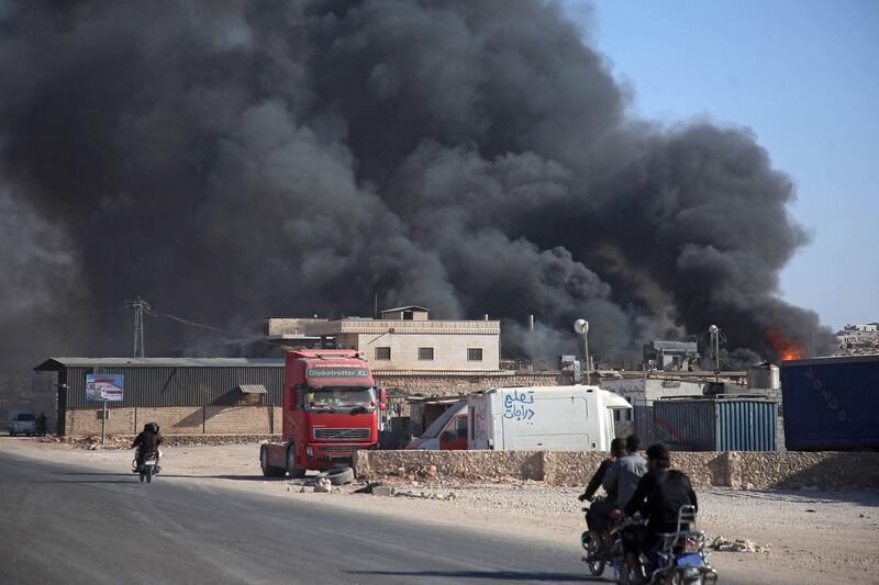 Smoke billows from a warehouse after shelling of the north-west Syrian town of Sarmada. Photo: AFP