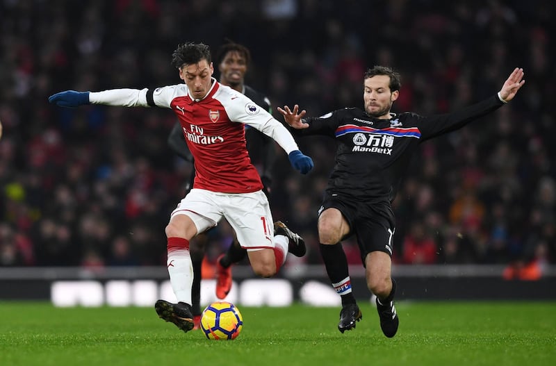 Soccer Football - Premier League - Arsenal vs Crystal Palace - Emirates Stadium, London, Britain - January 20, 2018   Arsenal's Mesut Ozil in action with Crystal Palace's Yohan Cabaye             REUTERS/Dylan Martinez    EDITORIAL USE ONLY. No use with unauthorized audio, video, data, fixture lists, club/league logos or "live" services. Online in-match use limited to 75 images, no video emulation. No use in betting, games or single club/league/player publications.  Please contact your account representative for further details.