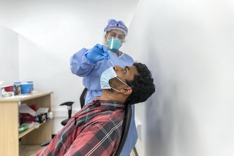 ABU DHABI, UNITED ARAB EMIRATES. 16 APRIL 2020. COVID-19 Testing station in Al Mussafah. A man gets tested inside the testing facility for COVID-19. (Photo: Antonie Robertson/The National) Journalist: Haneen Dajani. Section: National.