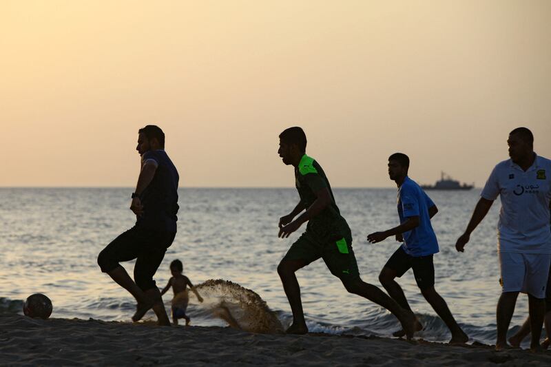 Omani youths play football on the beach at sunset in the capital Muscat. More than 90 per cent of young Omanis believe their voice matters to their country's leadership. Photo: Mohammed Mahjoub / AFP