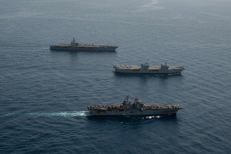 Handout from 2021 shows the amphibious assault ship USS Iwo Jima, front, the Royal Navy aircraft carrier HMS Queen Elizabeth and the aircraft carrier USS Ronald Reagan in the Gulf of Aden. Abacapress.com