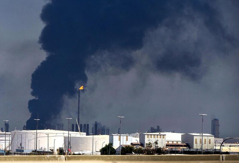 Smoke rises from a unit at oil refinery in Al Shuaiba, about 50km south of Kuwait City. Raed Qutena / EPA