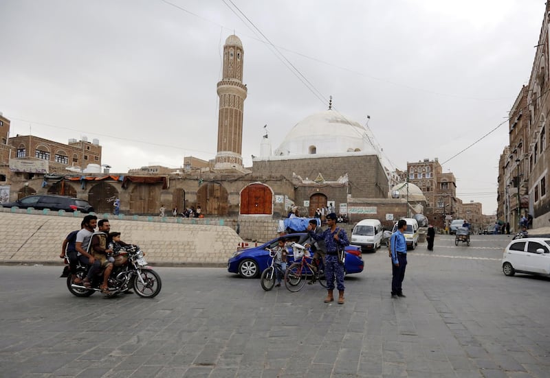 epa07568215 Policemen regulate traffic at a street in the old quarter of Sana'a, Yemen, 13 May 2019. According to reports, the United Nations currently seeks to boost the confidence-building measures agreed by both Yemen's Saudi-backed government and Houthi rebels, two days after the Houthis began withdrawing from the ports of the western city of Hodeidah under a UN-brokered peace deal, in a renewed attempt to end more than four years of ongoing fighting in Yemen.  EPA/YAHYA ARHAB