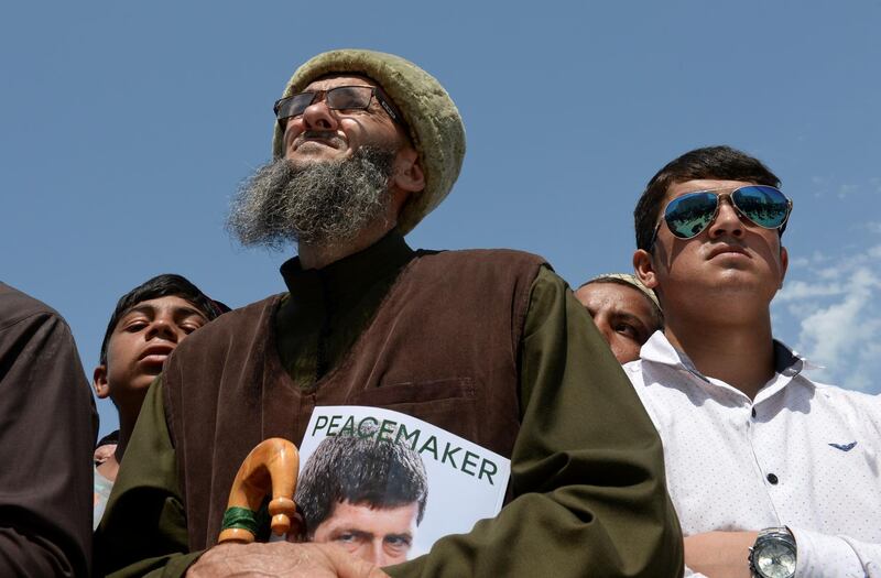 People gather outside the new mosque.