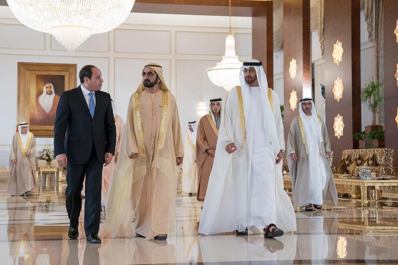 ABU DHABI, UNITED ARAB EMIRATES - February 06, 2018: HH Sheikh Mohamed bin Rashid Al Maktoum, Vice-President, Prime Minister of the UAE, Ruler of Dubai and Minister of Defence (2nd L) and HH Sheikh Mohamed bin Zayed Al Nahyan, Crown Prince of Abu Dhabi and Deputy Supreme Commander of the UAE Armed Forces (R) receive HE Abdel Fattah El Sisi, President of Egypt (L), during a reception at the Presidential Airport. Seen with HH Sheikh Mansour bin Zayed Al Nahyan, UAE Deputy Prime Minister and Minister of Presidential Affairs and HH Sheikh Hamed bin Zayed Al Nahyan, Chairman of the Crown Prince Court of Abu Dhabi and Abu Dhabi Executive Council Member (back). 


( Mohamed Al Hammadi / Crown Prince Court - Abu Dhabi )
---